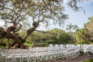 Outdoor Florida Garden Wedding Ceremony Decor, White Folding Chairs in Semi Circle Formation | Tampa Bay Photographer Cat Pennenga Photography | Sarasota Wedding Venue Marie Selby Botanical Gardens | Wedding Planner NK Productions