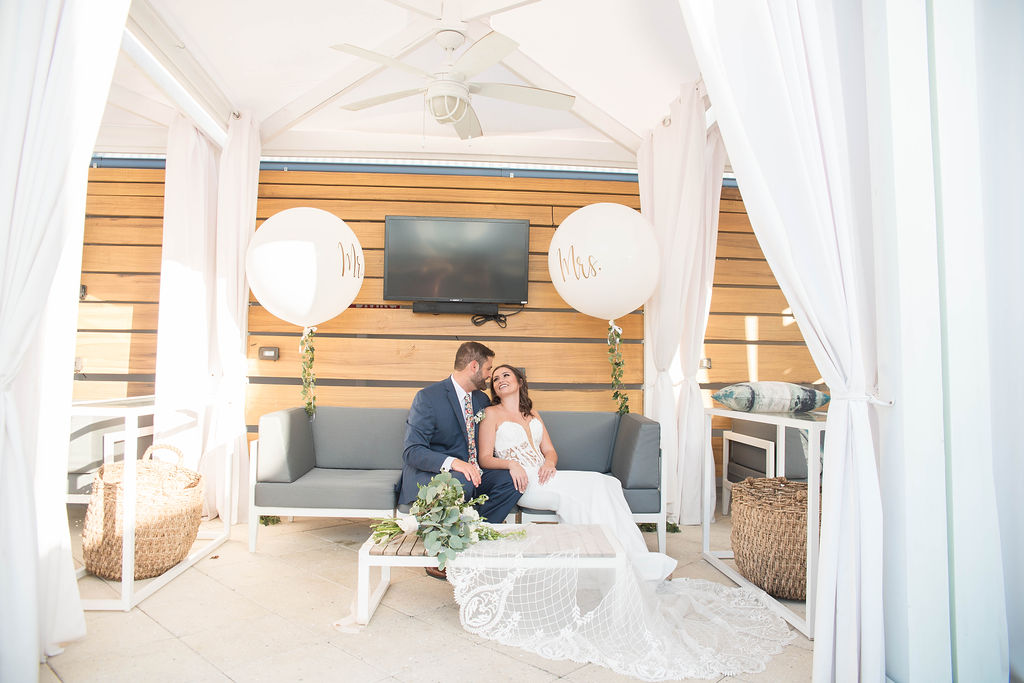 Outdoor Hotel Poolside Lounge Bride and Groom Wedding Portrait with Large Oversized White Balloon | Tampa Wedding Photographer Kristen Marie Photography | Waterfront Hotel Tampa Venue The Godfrey