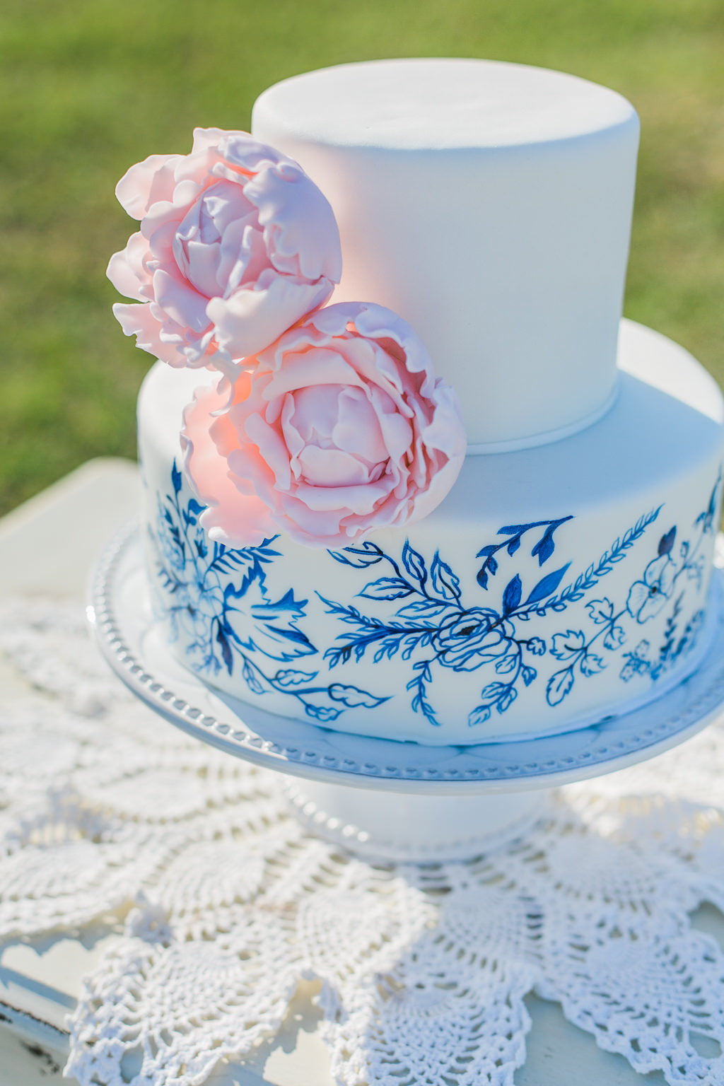 Two Tier Wedding Cake, Blue Painted Florals Design and Blush Pink Florals on Antique White Table