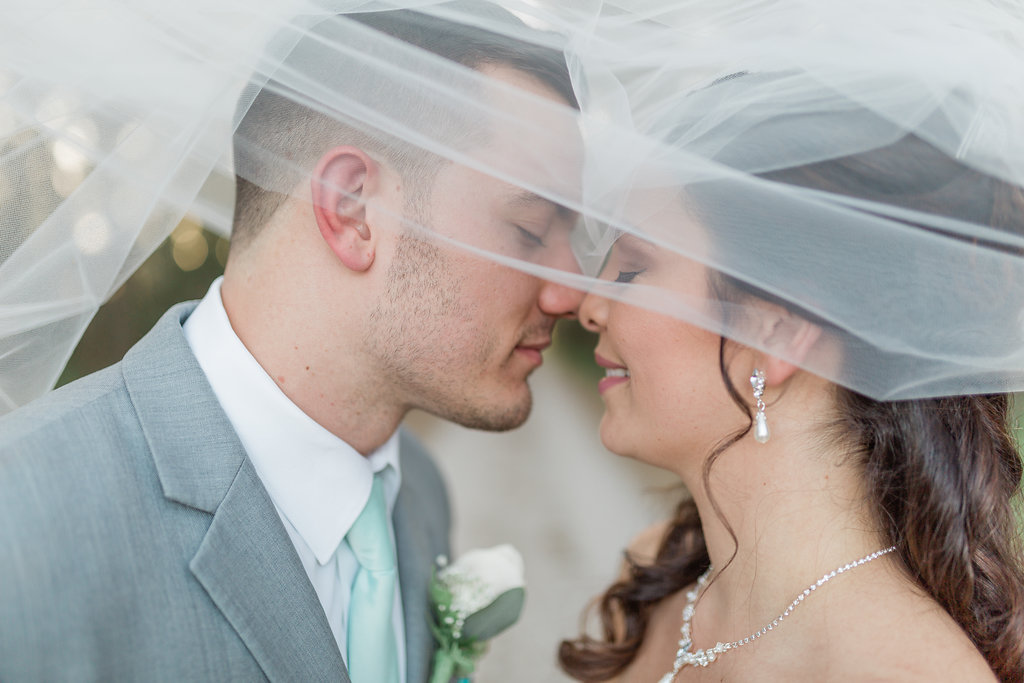 Creative Bride and Groom Tampa Bay Wedding Portrait Under Veil