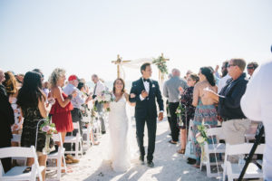 St. Pete Beach Outdoor Bride and Groom Ceremony Exit Wedding Portrait | Tampa Bay Photographer Kera Photography | St. Pete Beach Wedding Venue Tradewinds Island Resort