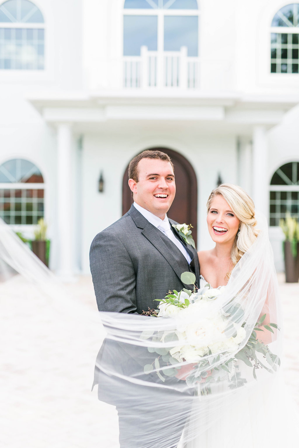 Florida Outdoor Bride and Groom Wedding Portrait with Veil Blowing in Wind | Clearwater Wedding Ceremony Venue Harborside Chapel | Tampa Bay Hair and Makeup Femme Akoi