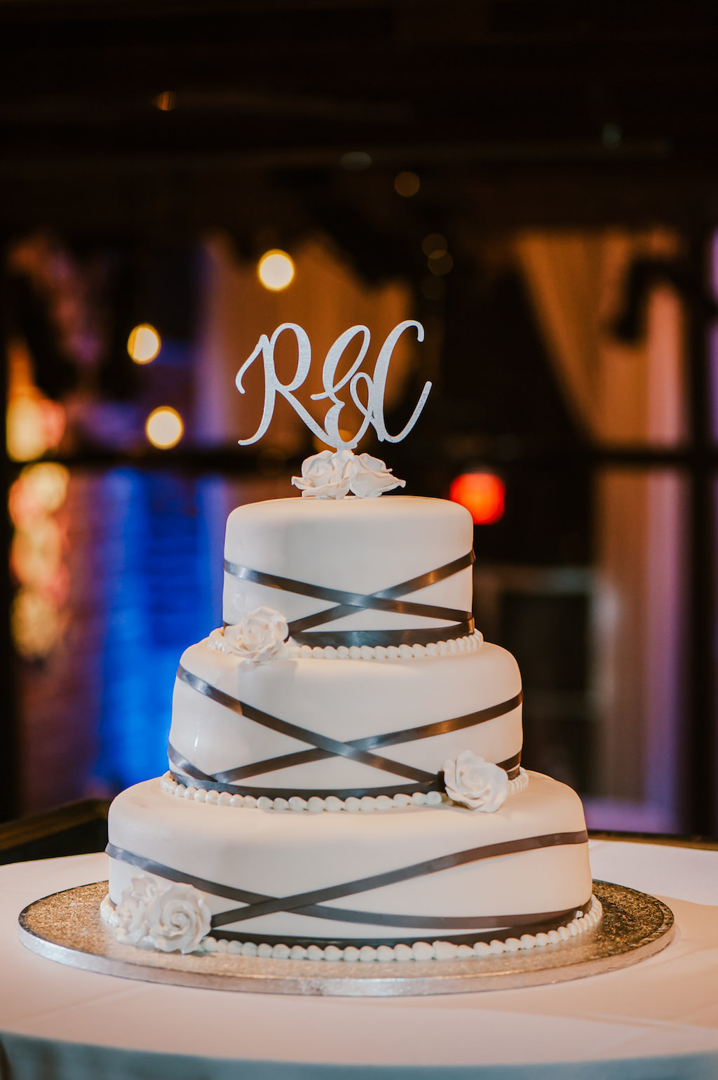 Three Tier Round White Fondant Wedding Cake with Silver Accents and Monogrammed Cake Topper