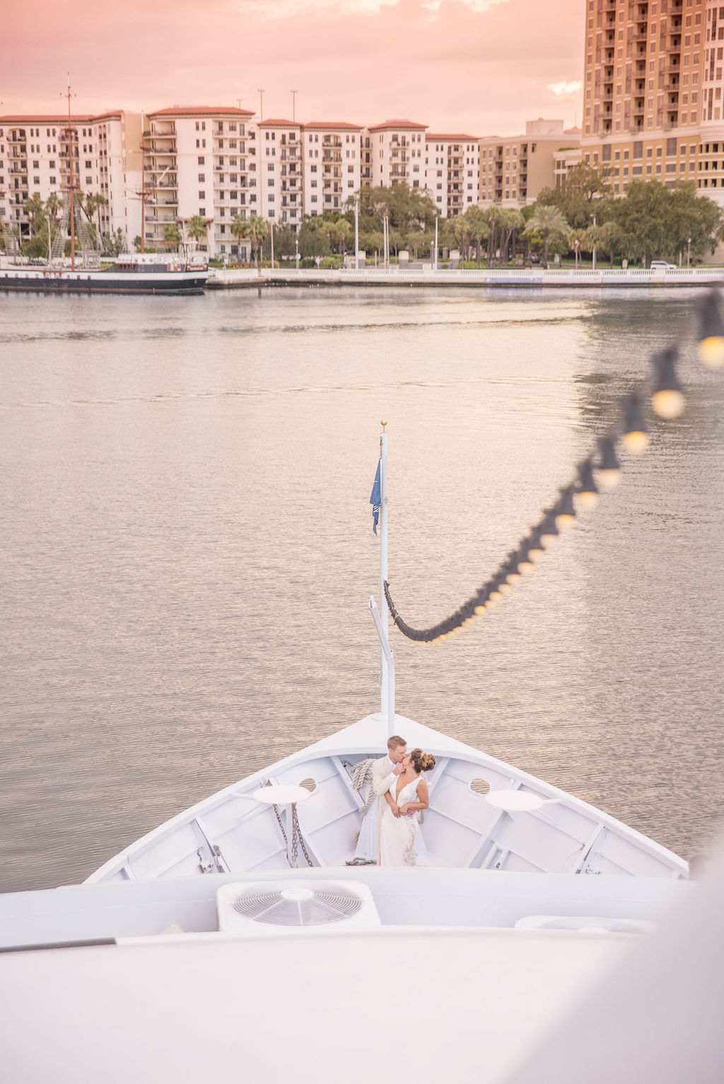 Florida Bride and Groom Sunset Wedding Portrait on Deck of Tampa Waterfront Venue Yacht Starship II | Tampa Bay Wedding Photographer Kristen Marie Photography