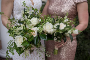 Bride and Bridesmaid Wedding Portrait, Bride in Ivory Lace Sheath Hayley Paige Gown with Sheer Nude Lining, Scalloped Deep V-Neckline, Bridesmaid in Rose Gold Sparkle Long Dress with Organic Greenery and White Roses Floral Bouquet | Tampa Bay Photographer Cat Pennenga Photography | Wedding Planner NK Productions