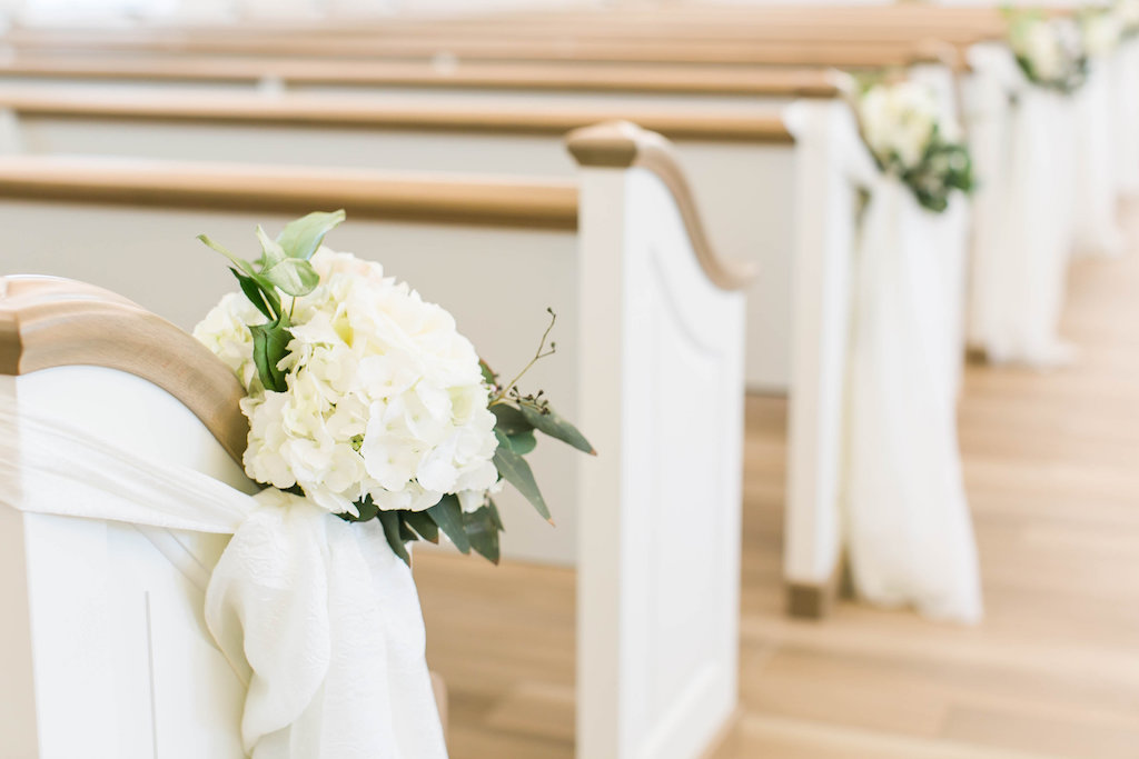 Wedding Ceremony Decor, White Hydrangeas and Greenery Leaves with White Ribbon | Clearwater Wedding Ceremony Venue Harborside Chapel
