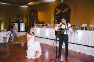 Groom Playing Guitar to Bride Wedding Ballroom Portrait | Tampa Bay Photographer Kera Photography | St. Pete Wedding Venue Tradewinds Island Resort