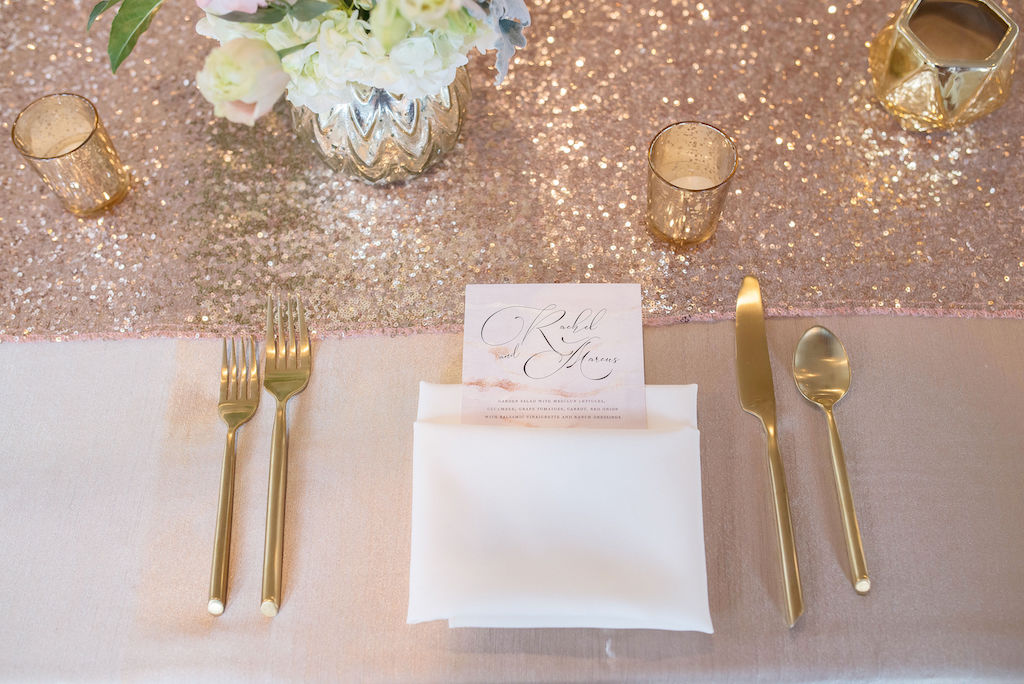 Elegant, Wedding Reception Decor, Gold Tablecloths, Low Blush Pink and Ivory Floral Centerpieces in Gold Vases, Blush Pink Glitter Sparkle Table Runner, Gold Silverware White Linens with Custom Menu and Gold Candle Votives | Tampa Bay Wedding Photographer Kristen Marie Photography | Tampa Bay Waterfront Wedding Venue Yacht Starship II | Linens Kate Ryan Event Rentals | Dinner Menu A&P Designs
