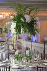 Florida Inspired Wedding Reception Decor | Tropical Inspired Wedding Reception Centerpieces with White Orchids and Palm Leaves