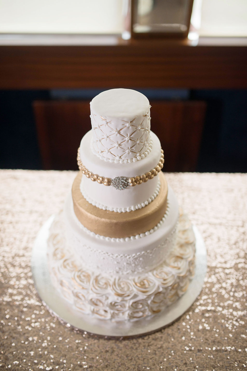 Elegant Five Tier White and Gold Wedding Cake with Rhinestone Brooch Accent | Tampa Bay Wedding Photographer Kristen Marie Photography