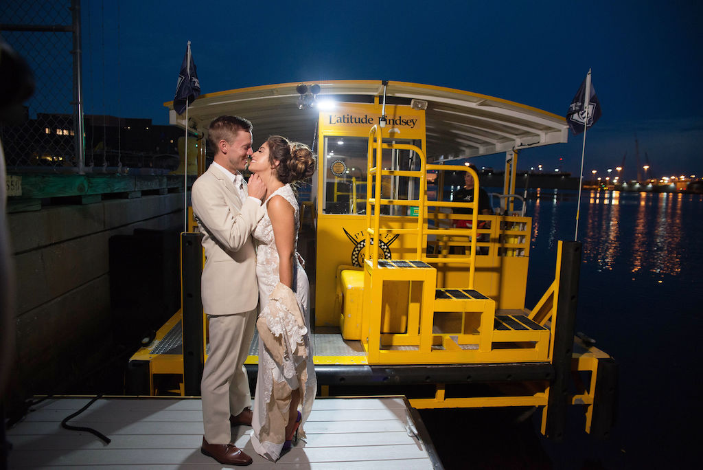 Florida Bride and Groom Nighttime Wedding Portrait on Pirate Water Taxi Boat Dock | Tampa Bay Wedding Photographer Kristen Marie Photography | Wedding Dress Nikki's Glitz and Glam Boutique | Menswear Sacino's Formalwear