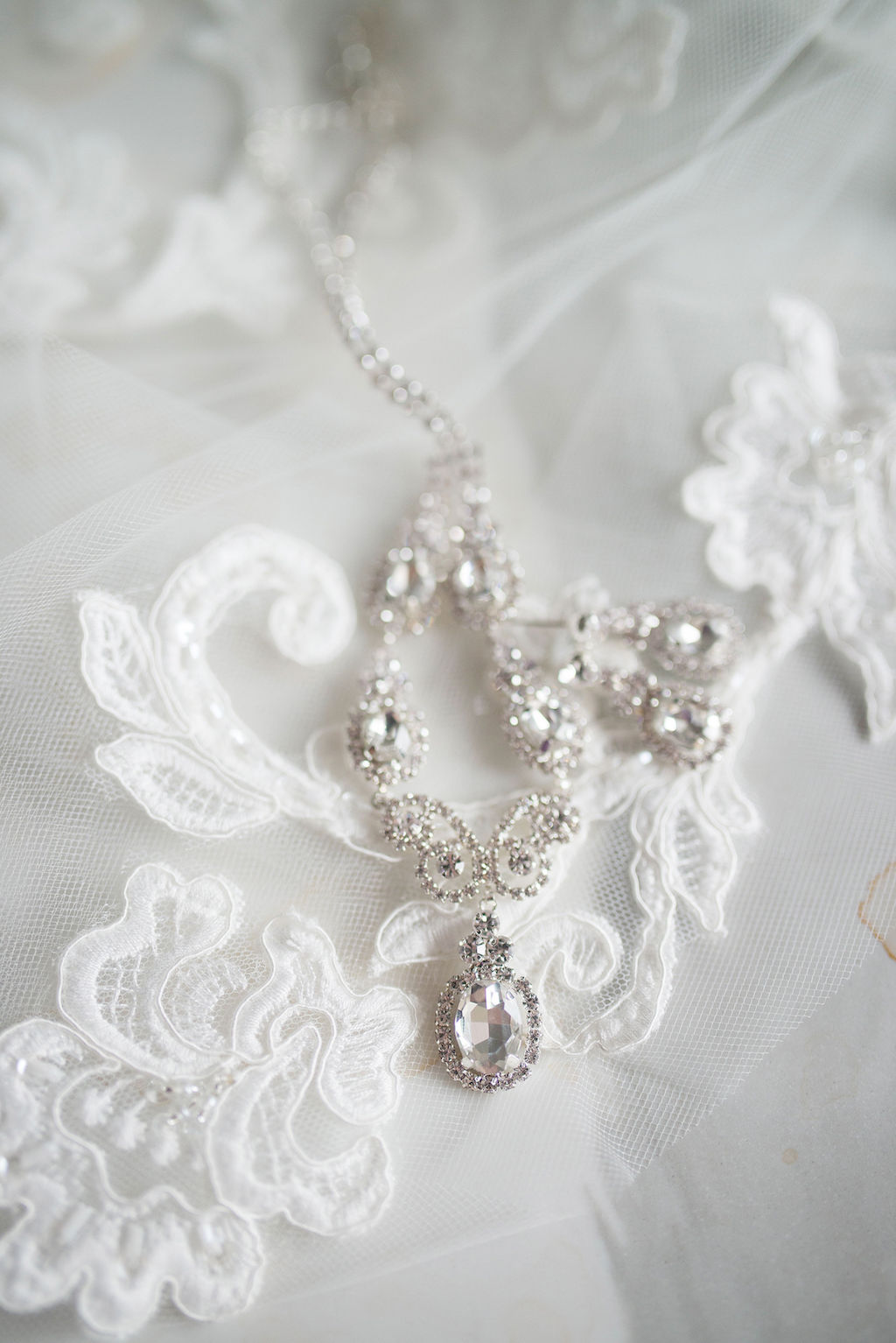 Diamond Drop Necklace and Earrings on Lace and Tulle Veil | Tampa Bay Wedding Photographer Kristen Marie Photography
