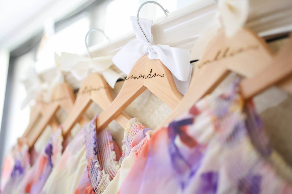 Colorful Floral Bridesmaids Dresses on Personalized Wooden Hangers | Tampa Bay Wedding Photographer Lifelong Photography Studios