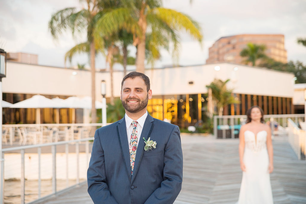 Outdoor Groom and Bride First Look Wedding Portrait, Groom in Colorful Floral Tie and Blue Suit with Succulent Boutonniere | Tampa Wedding Photographer Kristen Marie Photography | Tampa Venue The Godfrey