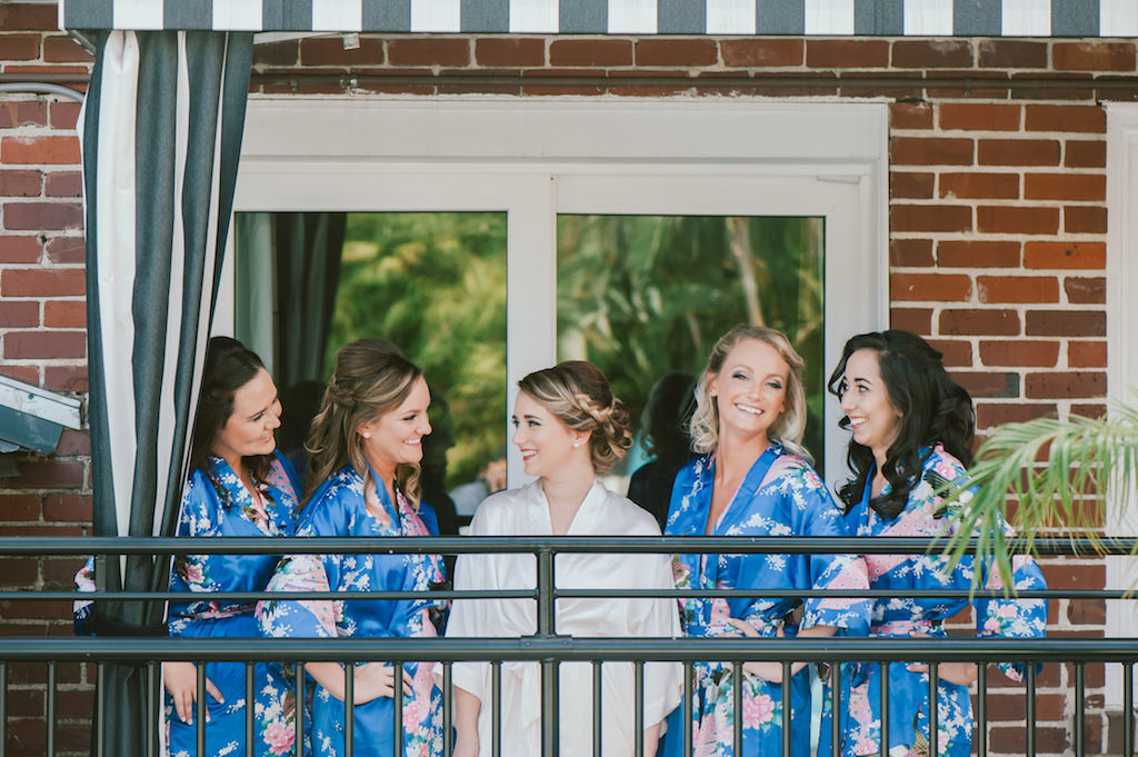 Bride and Bridesmaids Getting Ready Portrait, Bridesmaids in Blue and Pink Floral Silk Robes on Balcony