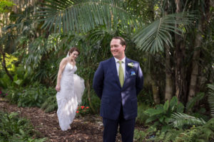 Outdoor Florida Garden Bride and Groom First Look Wedding Portrait | Tampa Bay Photographer Cat Pennenga Photography | Sarasota Wedding Venue Marie Selby Botanical Gardens