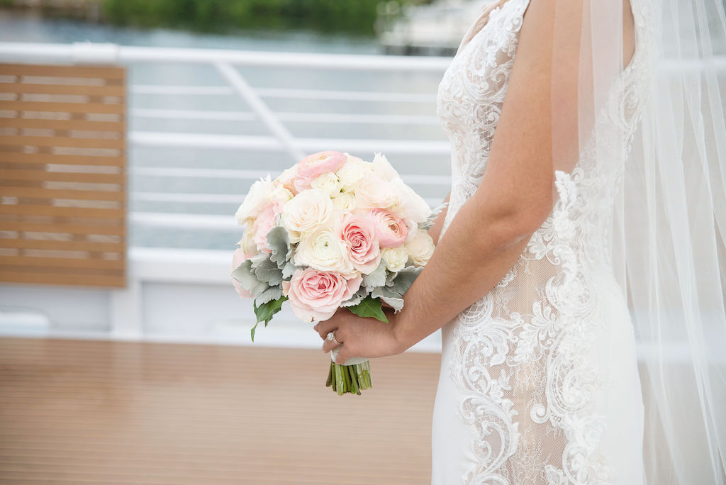Florida Bride Wedding Portrait in Deep V Neck Illusion Fitted Lace Tank Top Strap Wedding Dress with Blush Pink, Ivory and Dusty Miller Leaves Floral Bouquet | Tampa Bay Wedding Photographer Kristen Marie Photography | Wedding Dress Nikki's Glitz and Glam Boutique