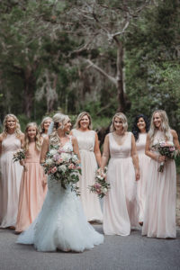 Bride and Bridesmaids Outdoor Wedding Portrait, Bridesmaids in Long Mismatched Style Blush Pink Dresses, Bride in Floral Lace Embellished Fit and Flare Wedding Dress with Straps, Wild Organic Blush Pink, Dusty Pink, White and Greenery Floral Bouquet | Tampa Bay Wedding Dress Shop Truly Forever Bridal