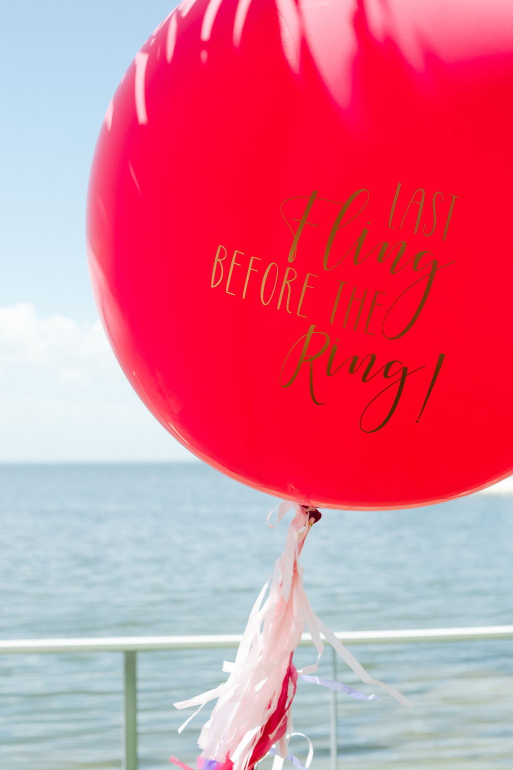 Custom Hot Pink Round Balloon with Quote in Gold and White Tassle for Bachelorette Party | Tampa Bay Photographer Grind and Press Photography
