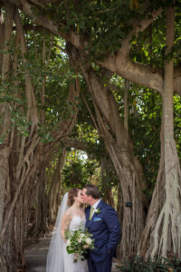 Outdoor Florida Garden Bride and Groom First Look Wedding Portrait | Tampa Bay Photographer Cat Pennenga Photography | Sarasota Wedding Venue Marie Selby Botanical Gardens