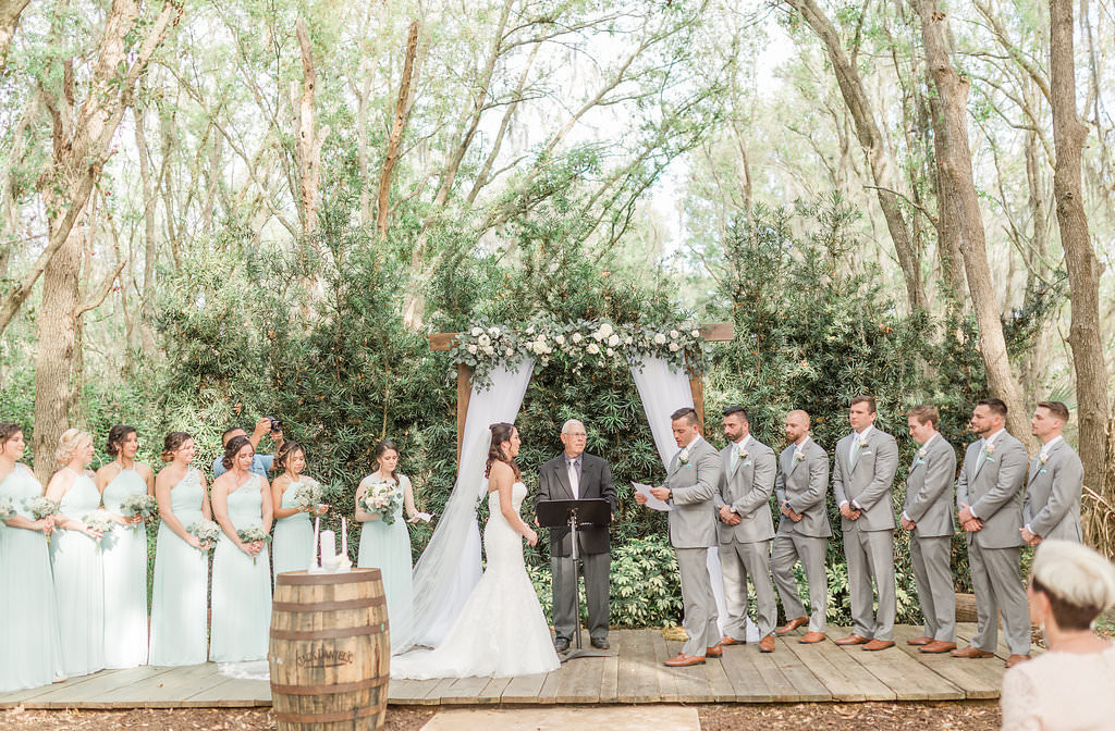 Outdoor Rustic Elegant Tampa Bay Wedding Ceremony Portrait, Bride, Groom Bridesmaids and Groomsmen, Bridesmaids in Mint Green Long Dresses, Groomsmen in Grey Suits | Plant City Wedding Venue Florida Rustic Barn Weddings