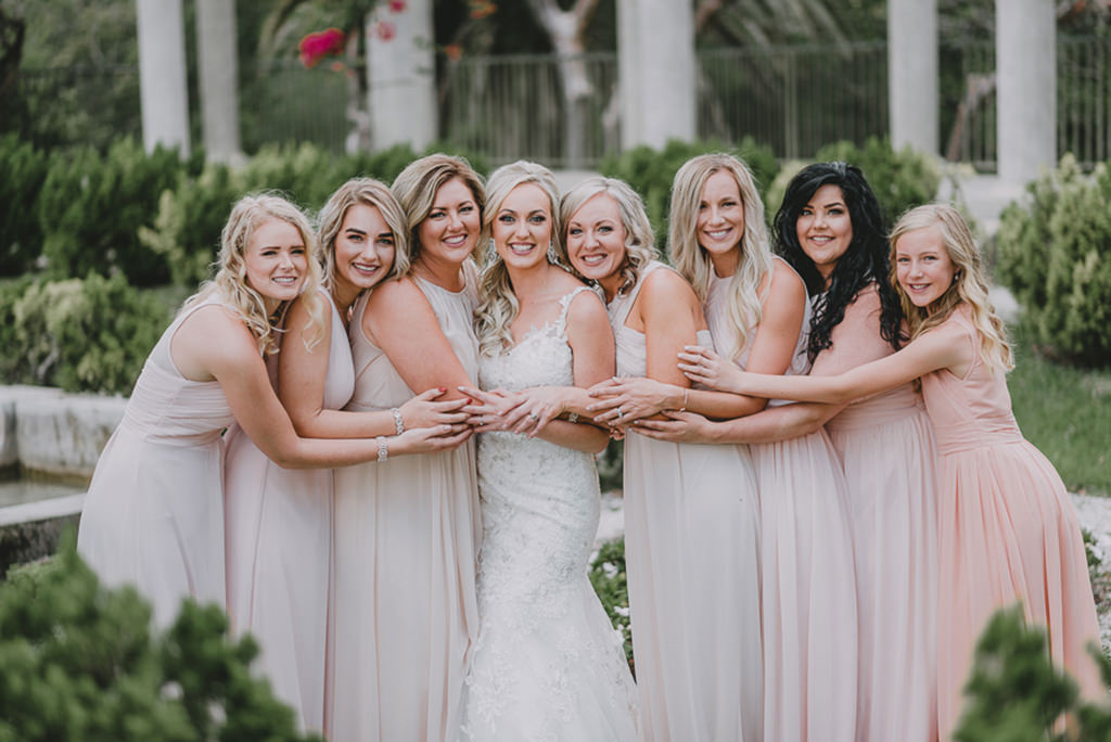 Bride and Bridesmaids Outdoor Wedding Portrait, Bridesmaids in Long Mismatched Style in Blush Pink Dresses, Bride in Floral Lace Embellished V Neck Fit and Flare Wedding Dress with Straps | Tampa Bay Wedding Dress Truly Forever Bridal