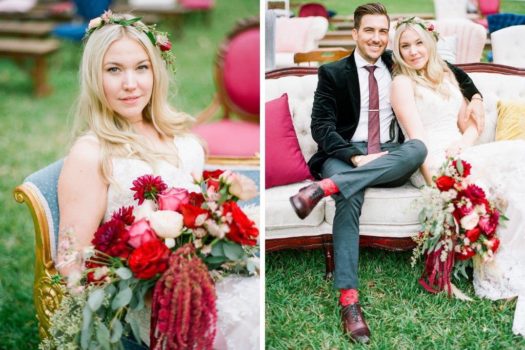 Boho Chic Inspired Bride and Groom Wedding Portrait on Vintage Loveseat Couch, Bride in Fitted Lace Wedding Dress with Red, Pink, Ivory and Greenery Floral Bouquets and Floral Headpiece Accessory, Groom in Green Velvet Suit | Tampa Bay Bridal Shop Nikkis Glitz and Glam Bridal Boutique