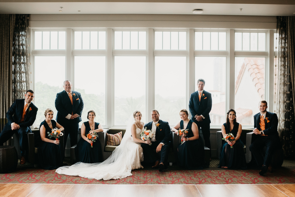 Florida Bridal Party Wedding Portrait, Bridesmaids in Matching Navy Blue Dresses, Groomsmen in Navy Blue Suits with Orange Ties