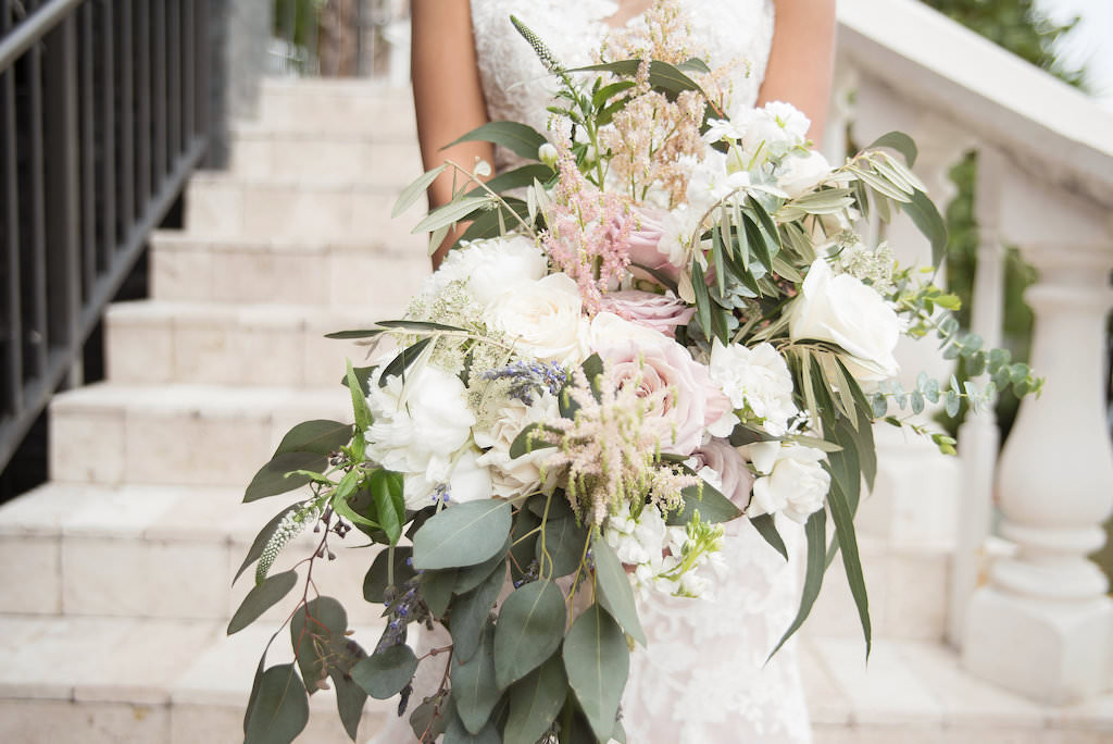 Florida Bride Outdoor Wedding Portrait on Staircase in Fitted Lace and Illusion Cap Sleeve Wedding Dress with Organic Garden Inspired White, Blush Pink, Greenery Floral Bouquet | Tampa Bay Wedding Photographer Kristen Marie Photography