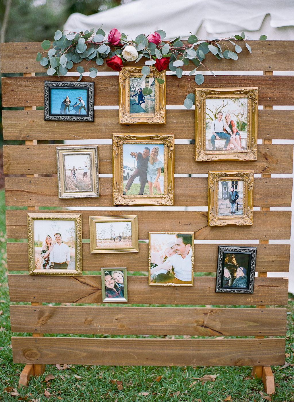 Boho Chic Vintage Inspired Lakeland Florida Outdoor Wedding Decor, Wooden Pallet with Framed Photographs and Red, White, Pink and Greenery Floral Accent