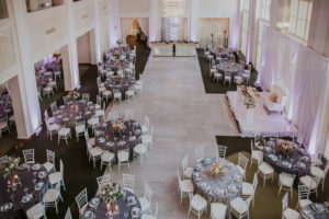 Modern Wedding Reception with Silver Chiavari Chairs and Round Tables with Purple Linens at Downtown Tampa Wedding Venue The Vault | Tampa Bay Wedding Photographer Brandi Image Photography