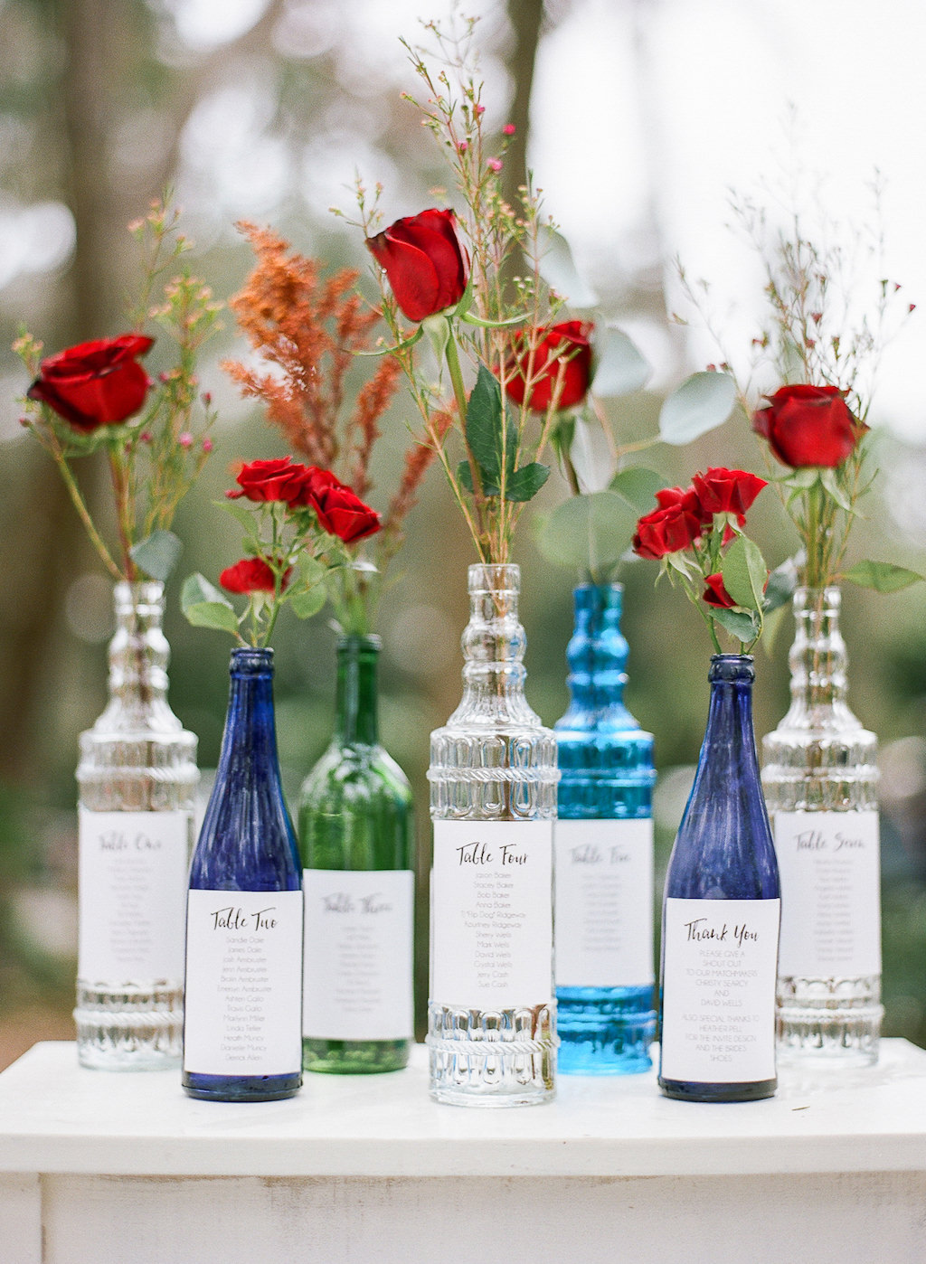 Vintage Inspired Wedding Reception Decor, Antique Blue, Clear and Green Bottle with Red Roses and Table Seating Chart
