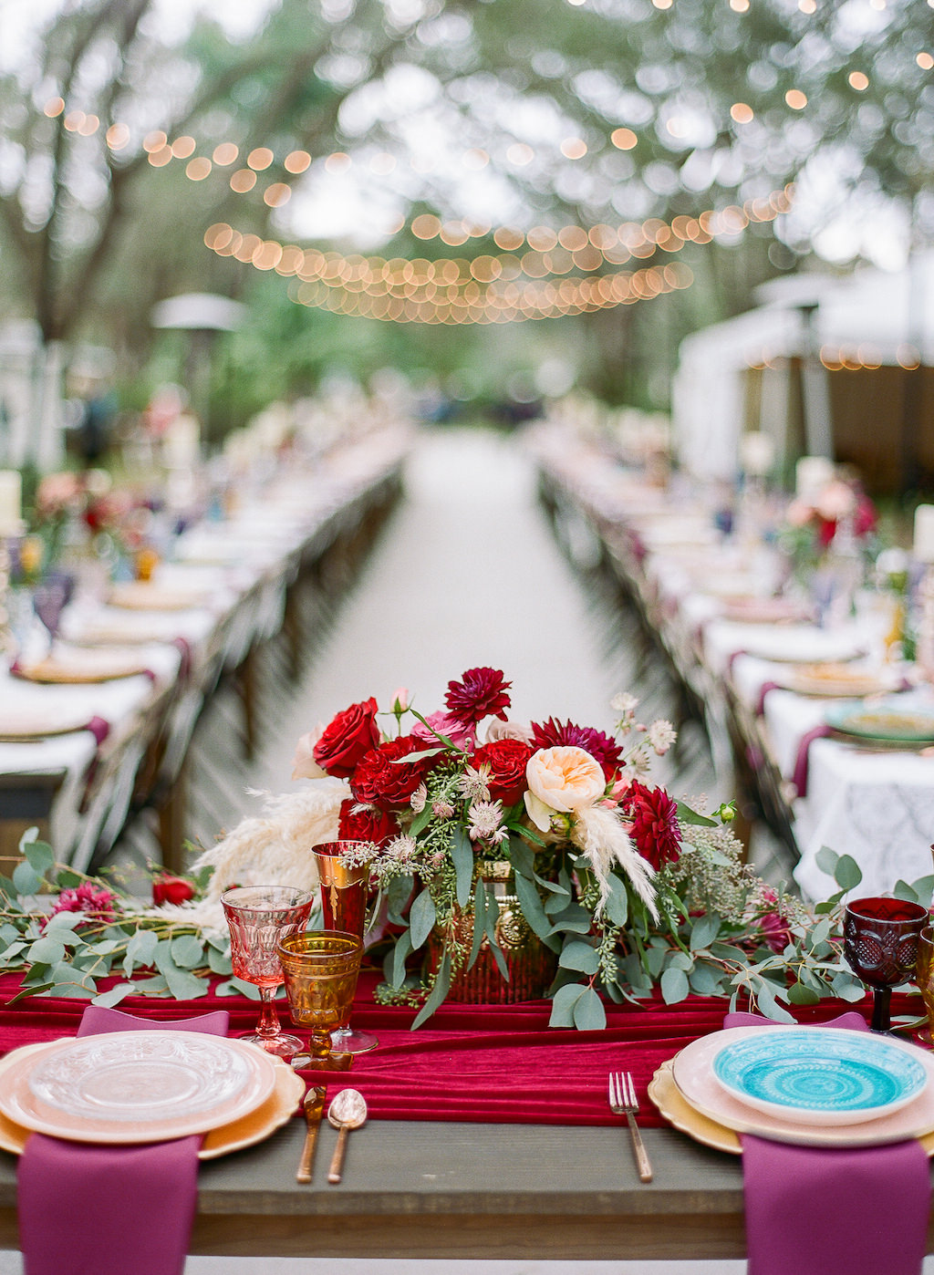 Boho Chic Vintage Wedding Outdoor Lakeland Florida Reception Decor, Sweetheart Table with Red Table Runner, Red Pink and Greenery Floral Centerpiece