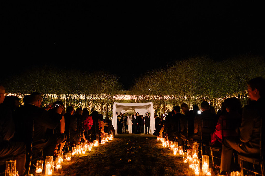 Outdoor Nighttime Jewish Wedding Ceremony With White Draped Chuppah