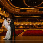 Bride and Groom Wedding Portrait on the Stage of Downtown St. Pete Wedding Venue the Mahaffey Theatre
