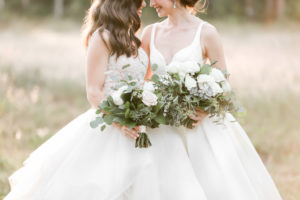 Outdoor Romantic Florida Bride and Bride Lesbian Gay Couple Wedding Portrait with Organic Wild Garden Inspired Blush Pink, White, Ivory, Greenery and Succulent Floral Bouquets | Tampa Bay Wedding Photographer Lifelong Photography Studio | Wedding Planner Love Lee Lane | Wedding Venue The Secret Garden at Paradise Spring