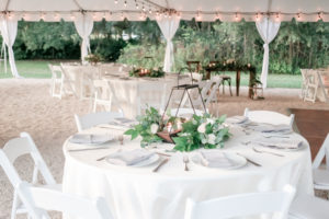 Nature Chic Inspired Tent Wedding Reception Decor, Round TABles with White Tablecloth, Geometric Centerpiece with Candles and Greenery and Ivory Roses | Wedding Planner Love Lee Lane | Tampa Bay Wedding Photographer Lifelong Photography Studio | Wedding Venue The Secret Garden at Paradise Spring