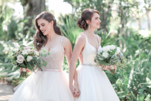 Florida LGBTQ Gay Same-Sex Bride First Look Holding Hands Lesbian Gay Couple Wedding Portrait with Organic Garden Inspired White, Ivory, Blush Pink and Greenery Wedding Floral Bouquets | Tampa Bay Wedding Photographer Lifelong Photography Studio | Wedding Planner Love Lee Lane