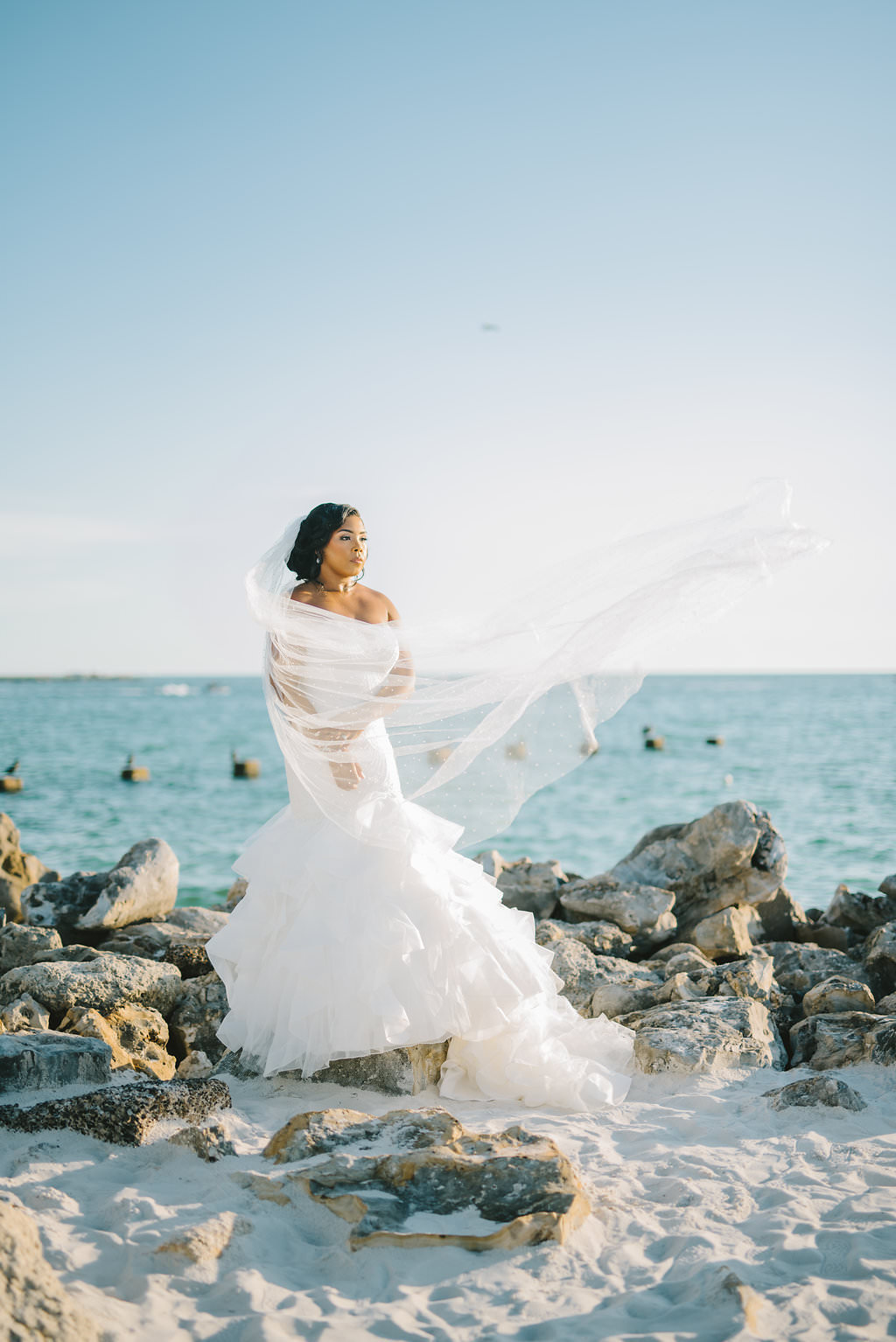 Beachfront Florida Bride Wedding Portrait with Veil Blowing in Wind | Tampa Bay Wedding Photographer Kera Photography | Clearwater Beach Wedding Venue Opal Sands Resort