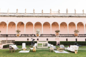 Outdoor Garden Courtyard Wedding Cocktail Decor, Loveseats and Vintage Chair, Gold Cocktail and Side Tables, Ivory and Mirror Bar | Sarasota Wedding Venue Ringling Museum | Tampa Bay Wedding Planner NK Weddings