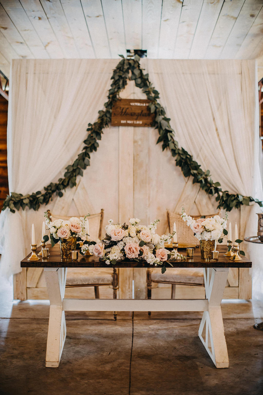 Florida Rustic Barn Wedding Reception Decor, Wooden Sweetheart Table with Blush Pink, Ivory Roses Centerpiece, White Draping with Greenery Garland