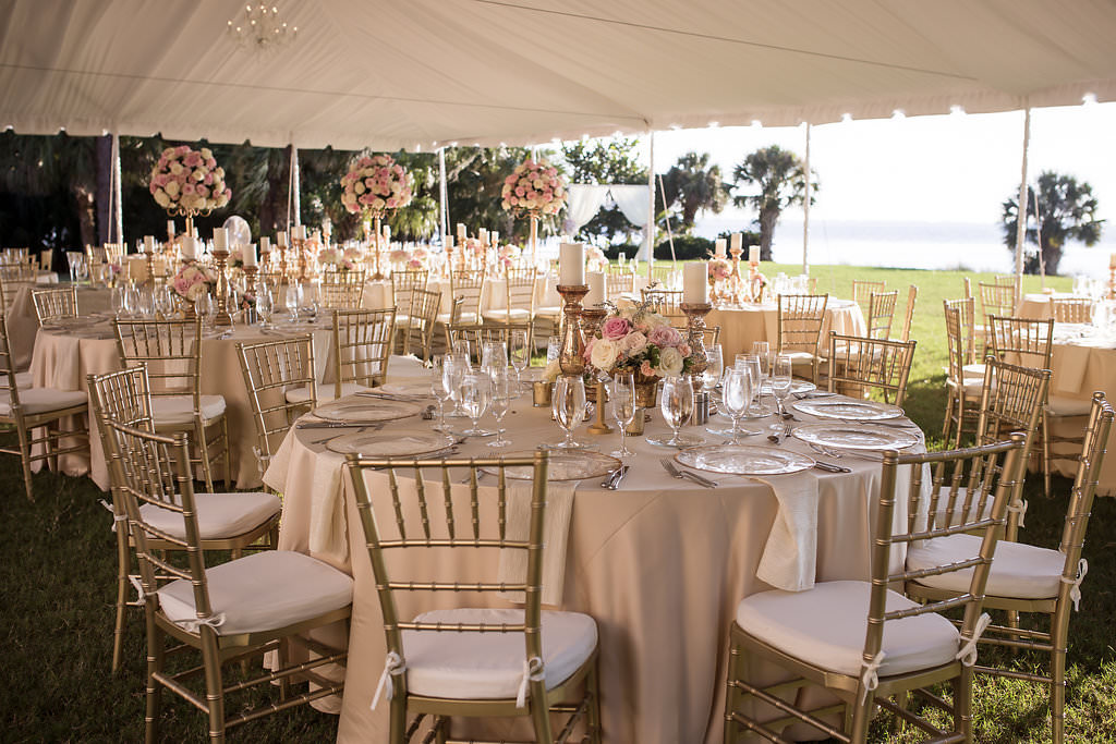 Florida Outdoor Tent Wedding Reception Decor, Round Tables, Gold Chiavari Chairs and Tall Blush Pink and White Floral Centerpieces, Long Feasting Table with Gold Candlesticks and Tall Floral Centerpieces | Tampa Bay Wedding Photographer Cat Pennenga Photography | Sarasota Wedding Venue Powel Crosley Estate | Wedding Planner NK Productions