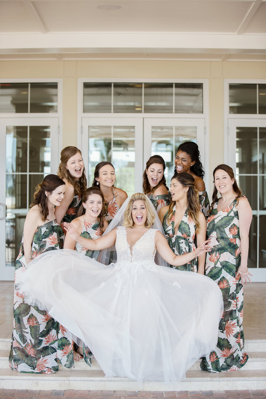 Florida Bride and Bridesmaids Wedding Portrait, Bridesmaids in Tropical Floral Long Matching Dresses, Bride in V Neckline Lace Tank Top Strap Wedding Dress | Tampa Bay Bridal Boutique Truly Forever Bridal