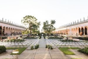 Elegant Modern Garden Courtyard Ceremony Decor, Ghost Chairs, Greenery and White Floral Ceremony Arch | Sarasota Wedding Venue Ringling Museum | Tampa Bay Wedding Planner NK Weddings