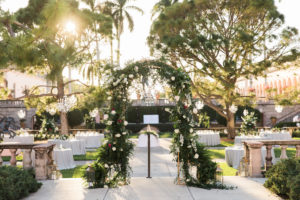 Elegant Modern Garden Courtyard Wedding Ceremony Decor, Greenery, White, Ivory, Red Arch, Gold Candlesticks, Brush Gold Lanterns | Sarasota Wedding Venue Ringling Museum | Tampa Bay Wedding Planner NK Weddings