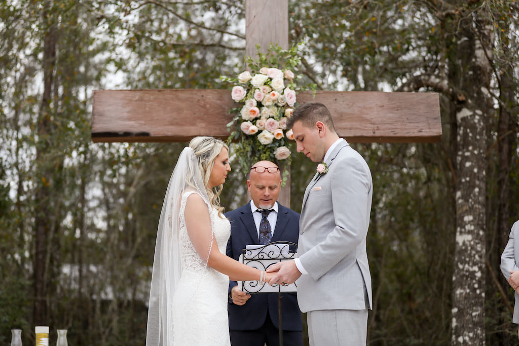 Rustic Bride and Groom Wedding Ceremony Portrait Exchanging Vows | Tampa Bay Wedding Photographer Lifelong Photography Studios | Florida Wedding Venue The White Barn | Tampa Bay Wedding Hair and Makeup Femme Akoi