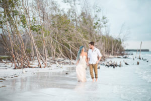 Florida Beachfront Wedding Styled Shoot, Bride and Groom Walking on Sand Wedding Portrait | St. Petersburg Wedding Venue Fort DeSoto Park