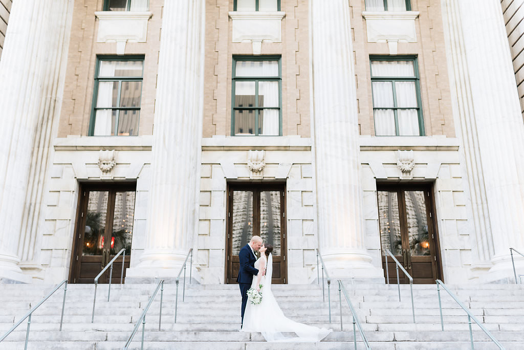 Outdoor Bride and Groom Wedding Portrait on Front Steps of Historic Courthouse | Downtown Tampa Hotel Venue Le Meridien