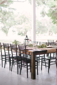 Tampa Bay Rustic Wedding Reception Decor, Long Wooden Table with Black Chiavari Chairs, Burlap Table Runner, Black Lantern and Greenery Garland