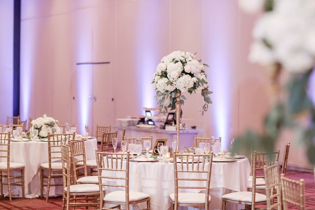 Wedding Reception Decor, Round Tables with White Tablecloths, Gold Chiavari Chairs and Tall White and Greenery Floral Centerpieces at Hilton Downtown Tampa Wedding Venue | Tampa Bay Wedding Photographer Lifelong Photography Studio